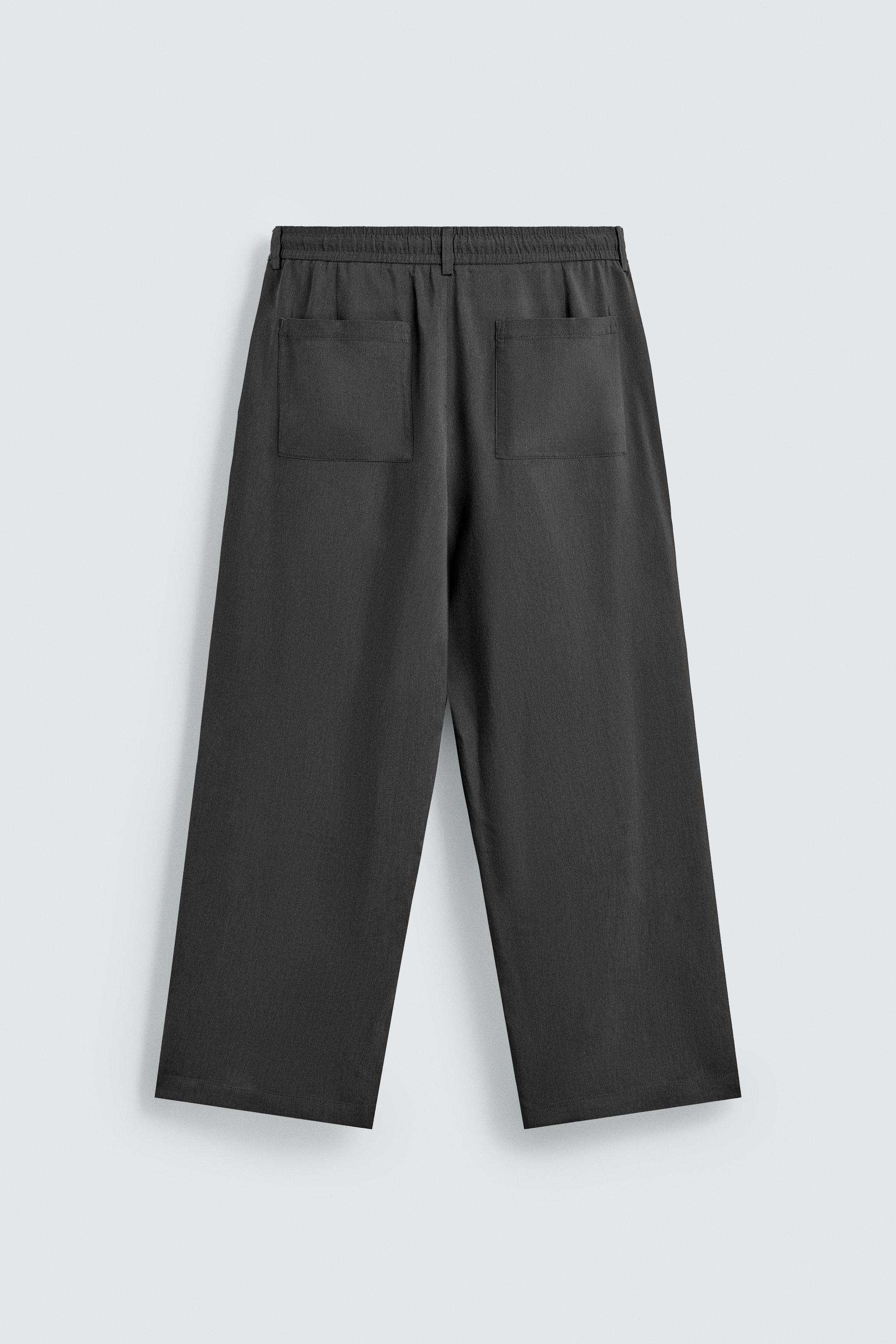 FLOWY PLEATED PANTS
